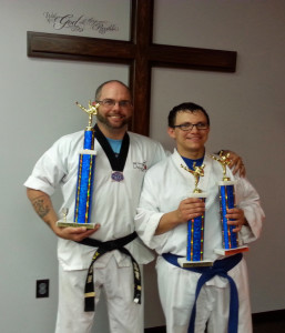 John Rediger posing with Mr. Dan Wittler, of Wittler’s Black Belt Academy. John earned one 1st and two 2nd place trophies at last week-end’s Region 8 Nationals.